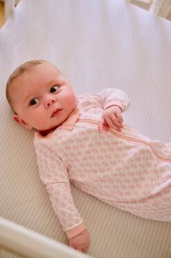 Lake Baby Sleeper In English Rose Blockprint 8 Lake Baby Sleeper In English Rose Blockprint -Fashion - Pajamas LAKE Webcrop Fall23 Lifestyle PimaFootedSleeper EnglishRoseBlockprint 0852